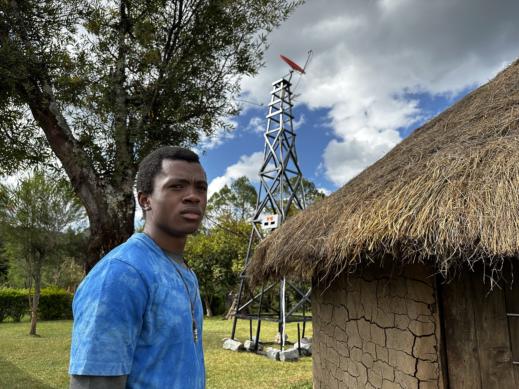 Thamela Mpumlwana at the mud hut in Kipkemboi