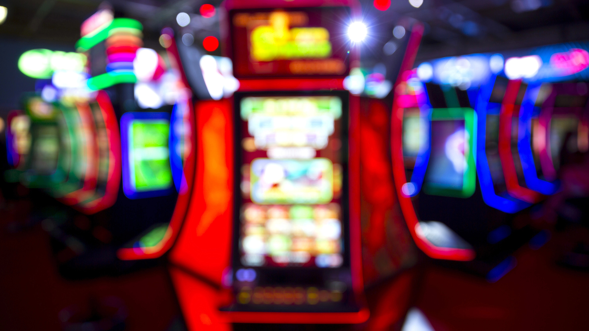 Out of focus blurry image of casino equipment. Blurred slot machines in a casino.