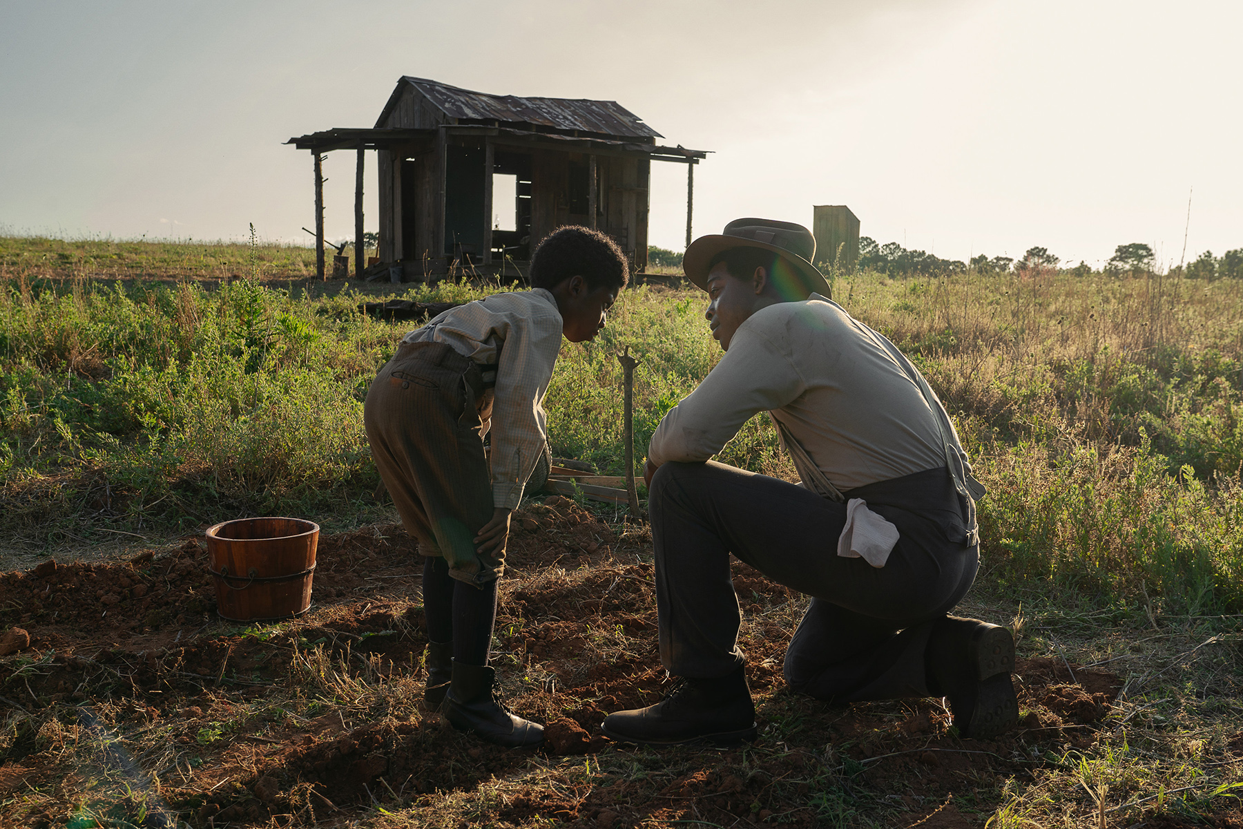 The Piano Lesson. (L-R) Isaiah Gunn as Young Boy Willie and Stephan James as Boy Charles in The Piano Lesson. Cr. David Lee/Netflix © 2024