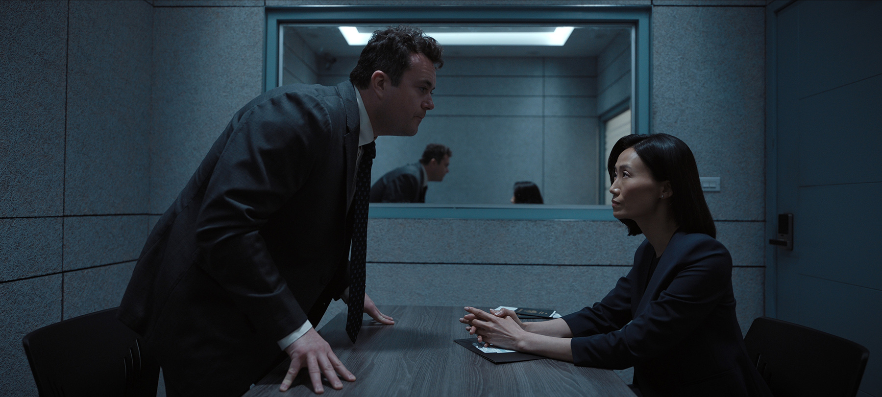 The Recruit. (L to R) Kristian Bruun as Janus Ferber, Kim Young-ah as Grace in Episode 201 of The Recruit. Cr. Courtesy of Netflix © 2024