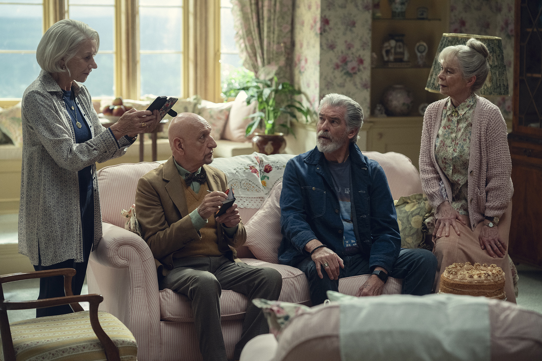 The Thursday Murder Club (L to R) Helen Mirren, Sir Ben Kingsley, Pierce Brosnan, and Celia Imrie. Photo Credit: Giles Keyte / Netflix