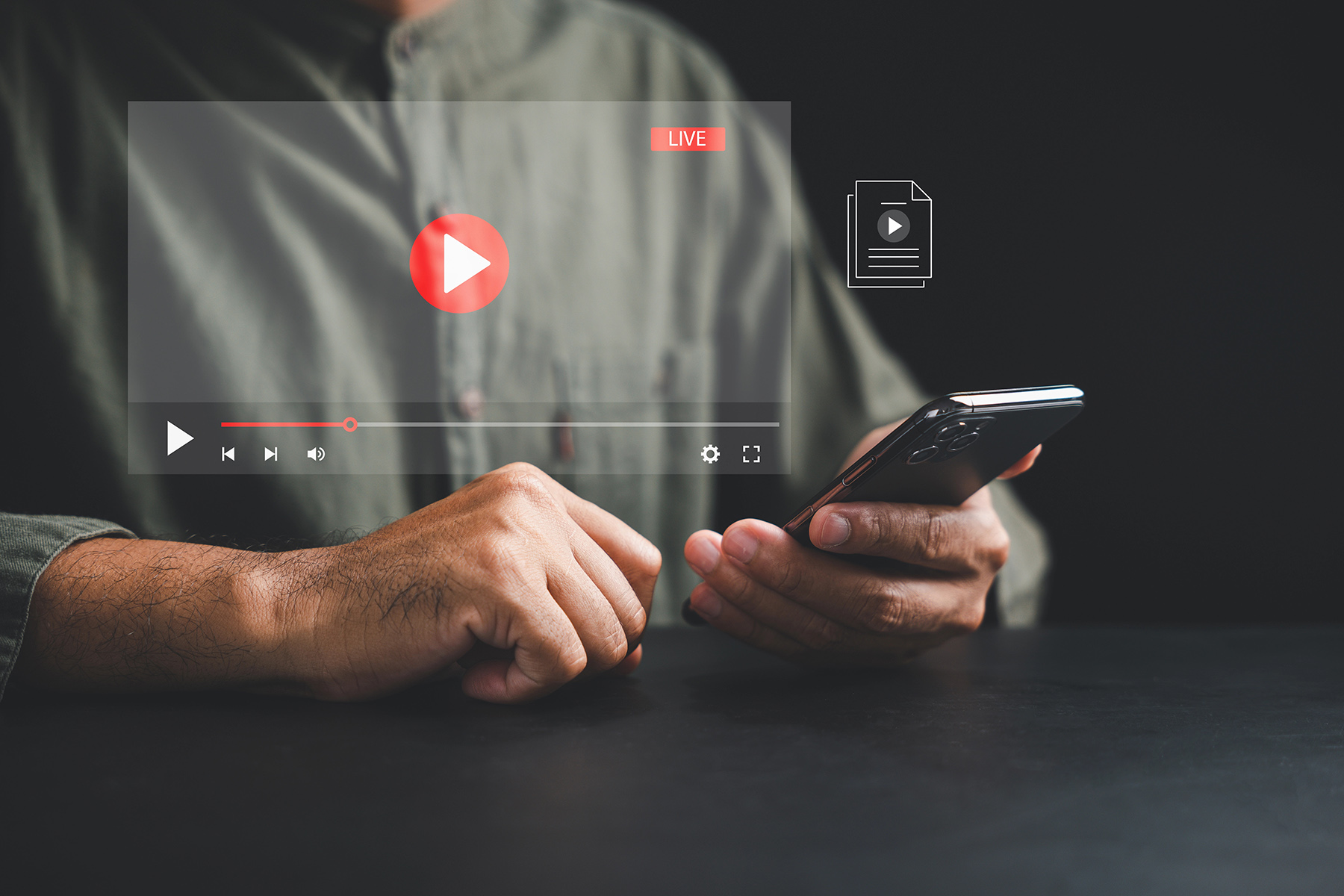 Unlock the world of online media with a smartphone as a young man indulges in movie streaming. Discover the convenience and flexibility of digital entertainment anytime, anywhere.